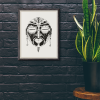 African mask art print featuring an oval face with sacred earrings, hand-drawn tribal wall art.