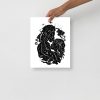 Cosmic Kiss black love art print on matte museum-quality paper displayed at an angle