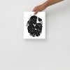 Cosmic Kiss black love art print on matte museum-quality paper displayed on a wall