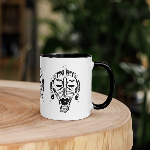 Afrocentric ceramic coffee mug with African mask art and colorful rim, handle, and interior