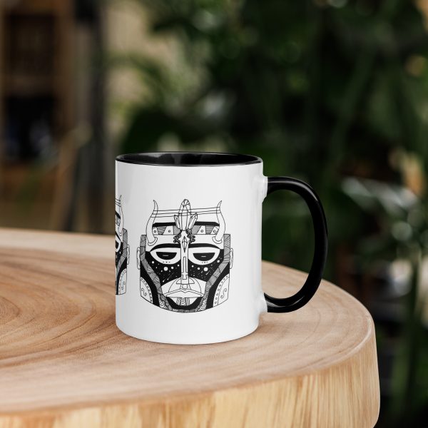 Afrocentric coffee mug featuring colorful African mask art with a vibrant rim, handle, and inside