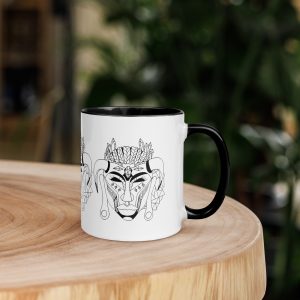 Afrocentric coffee mug featuring colorful African mask art with vibrant rim, handle, and interior