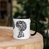 Afrocentric coffee mug featuring colorful Her Beautiful Mind artwork with vibrant rim and handle