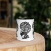 Afrocentric coffee mug with Melancholic Mind artwork and colorful rim, handle, and interior