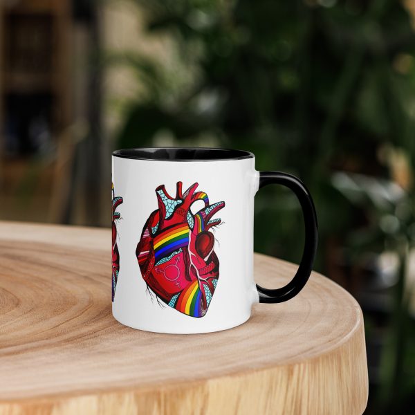Pride heart ceramic mug with rainbow rim, handle, and interior for coffee or tea