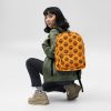 Orange and black African mask backpack with tribal design and water-resistant material