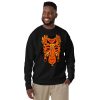 Orange and black African mask print crewneck sweatshirt with ribbed cuffs and soft fleece interior