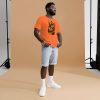 Black cotton t-shirt featuring an orange anatomical heart graphic, shown from a side angle