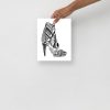 Minimal high heel art print on matte museum-quality paper displayed in a chic space