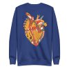 Musical heart sweatshirt with ribbed crew neck, long sleeves, and soft fleece interior