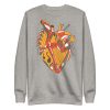 Musical heart sweatshirt with ribbed crew neck, long sleeves, and soft fleece interior