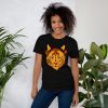 Black and orange Mystical Wildcat t-shirt shown from a side angle on soft cotton fabric