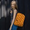 Orange and black octopus backpack with laptop pocket and water-resistant material