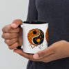 Orange and black yin yang coffee mug with colorful rim and handle for fall drinkware