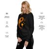 Orange and black yin yang sweatshirt with ribbed crew neck and long sleeves