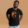 Orange and black yin yang t-shirt with circle graphic for a fall casual look