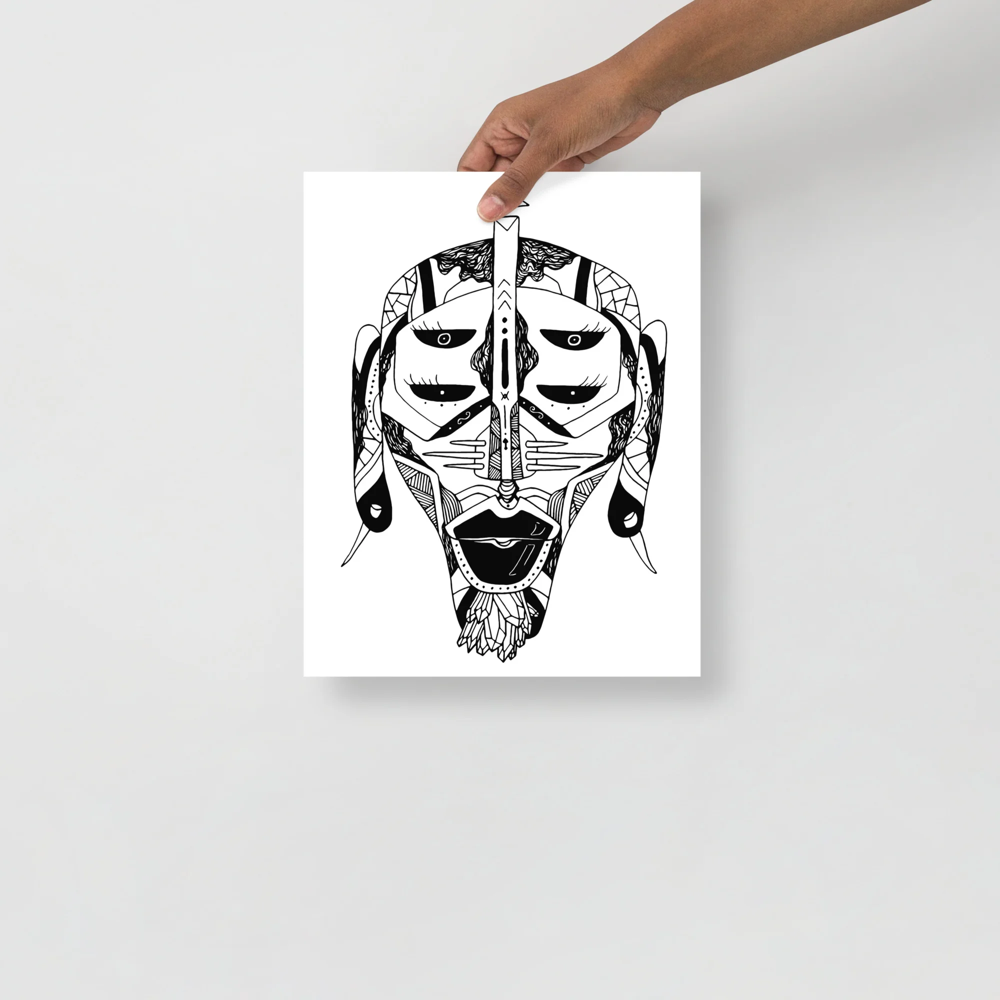 Black and white African mask art print with intricate tribal linework and geometric patterns on white paper