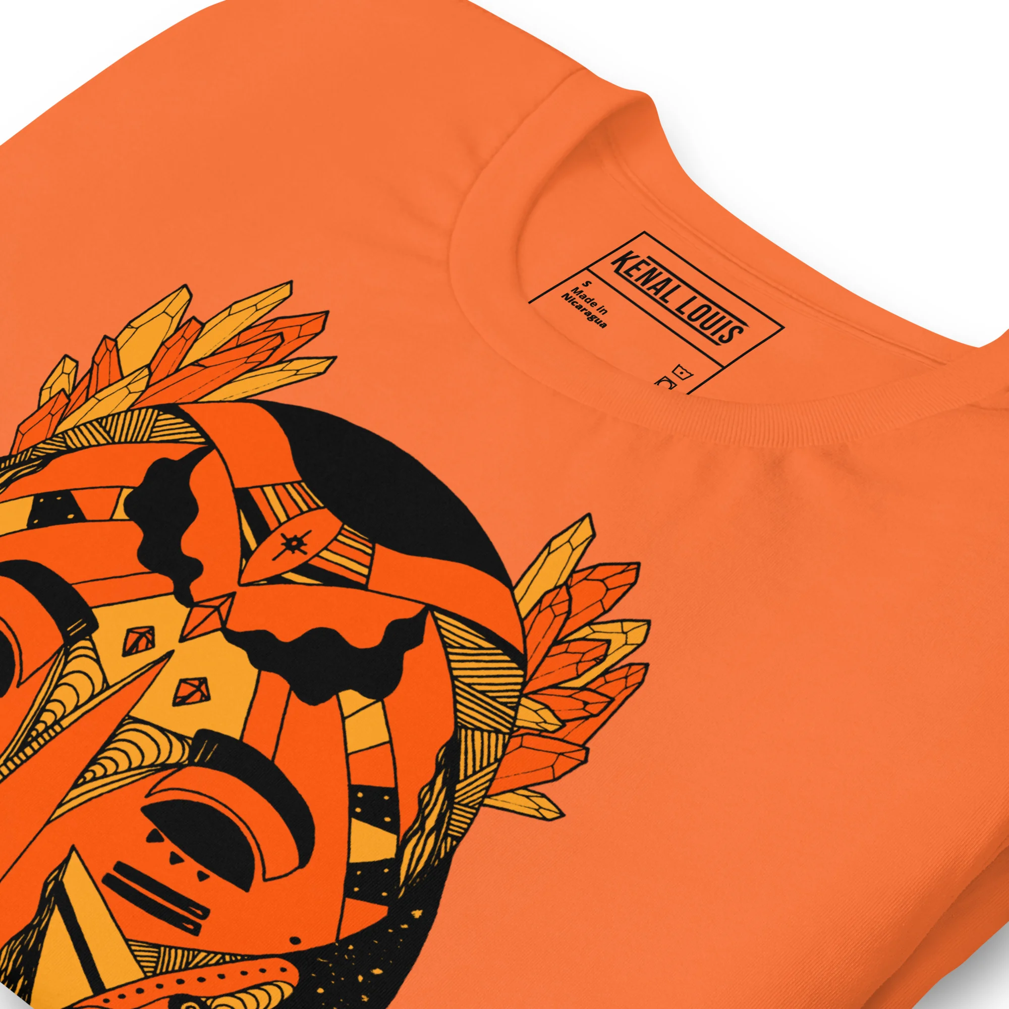 Orange African mask t-shirt featuring bold black and yellow tribal artwork design on front