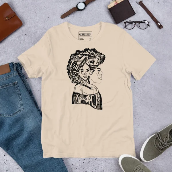 Soft cream afro woman t-shirt with black culture graphic displayed flat lay styled with accessories