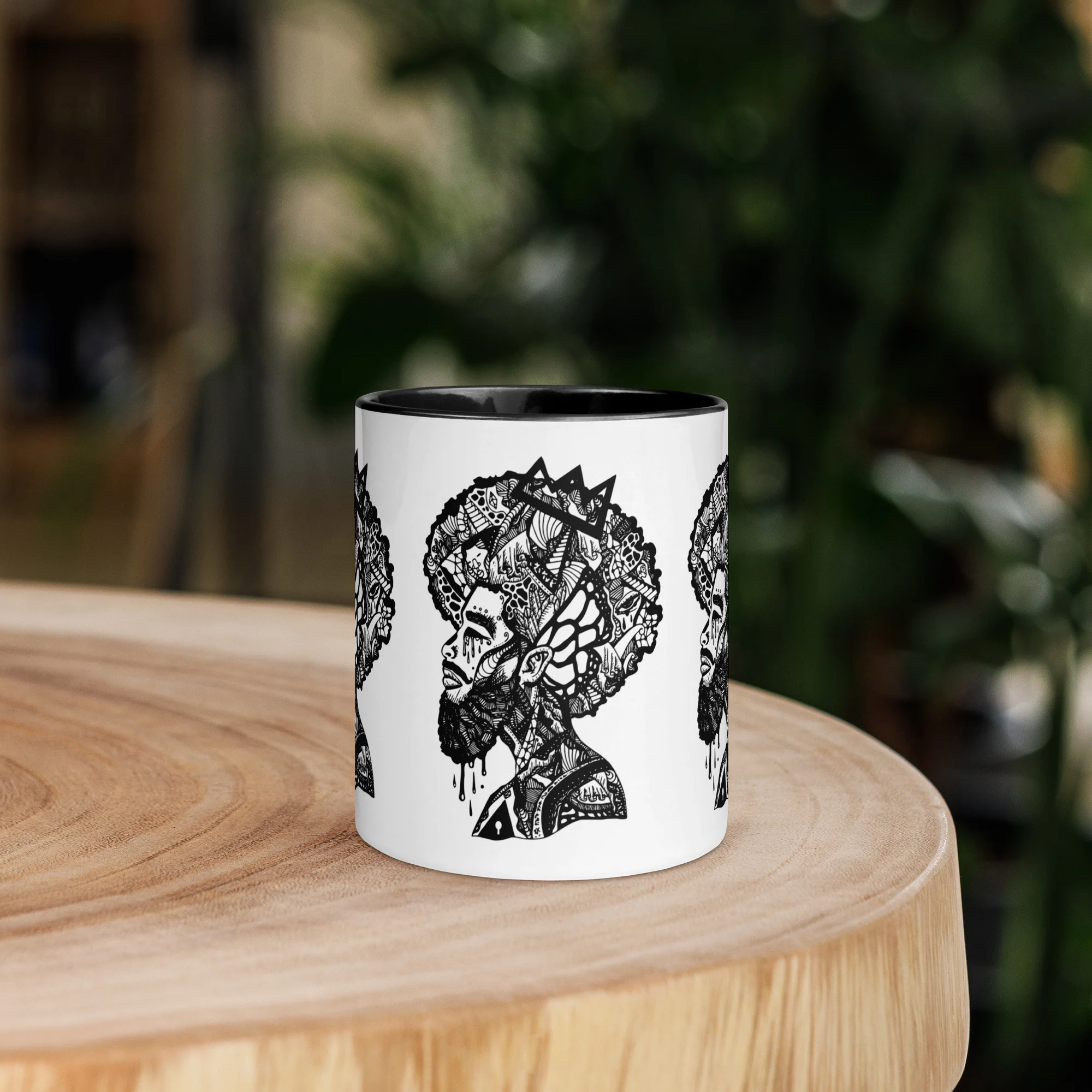 White afrocentric coffee mug with intricate black line art silhouette profile featuring detailed patterned hair and cultural designs