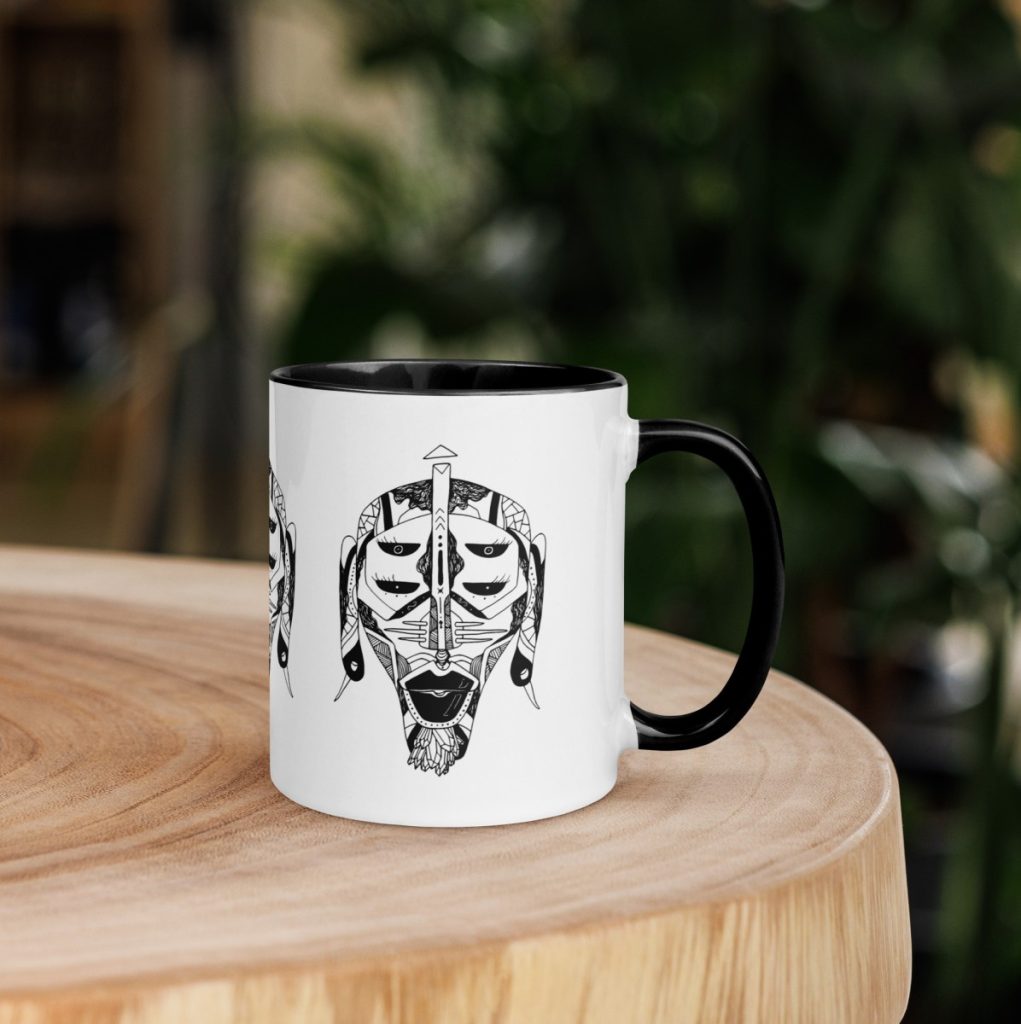 Detailed African mask artwork adorning an afrocentric ceramic art cup for daily use
