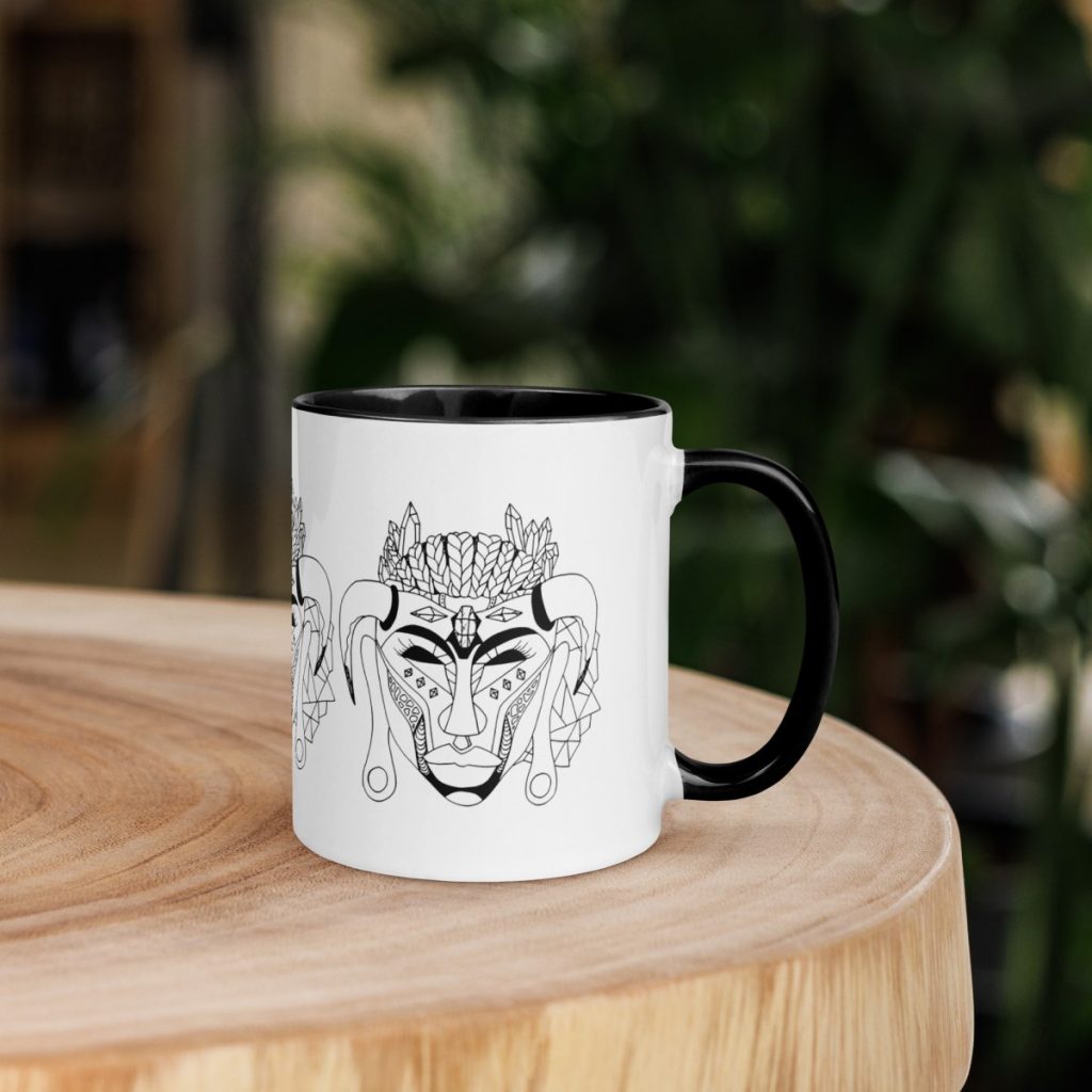 Bold striking African mask print on a strong afrocentric art ceramic coffee mug