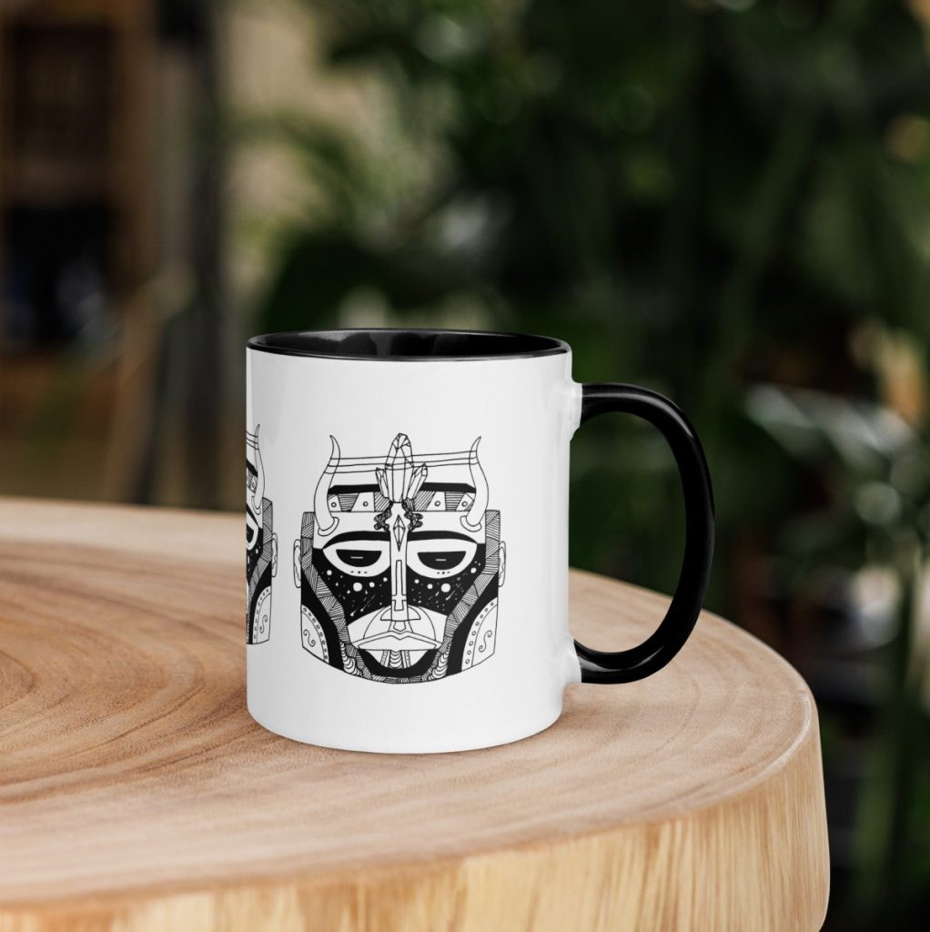 Elegant African mask motif gracing an afrocentric ceramic art tea cup beautifully