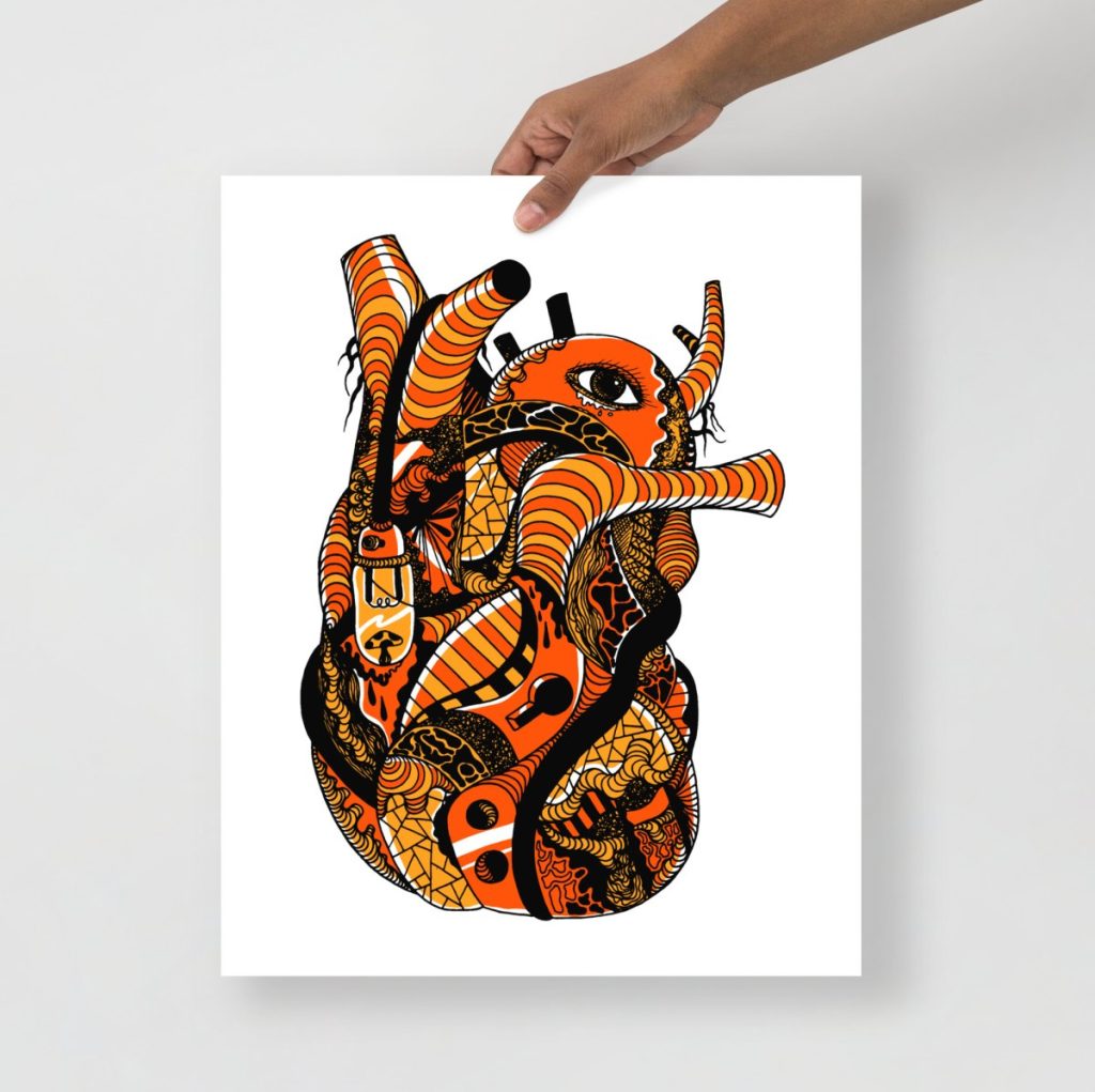Bold orange and black anatomical heart art print with striking contrast for wall decor