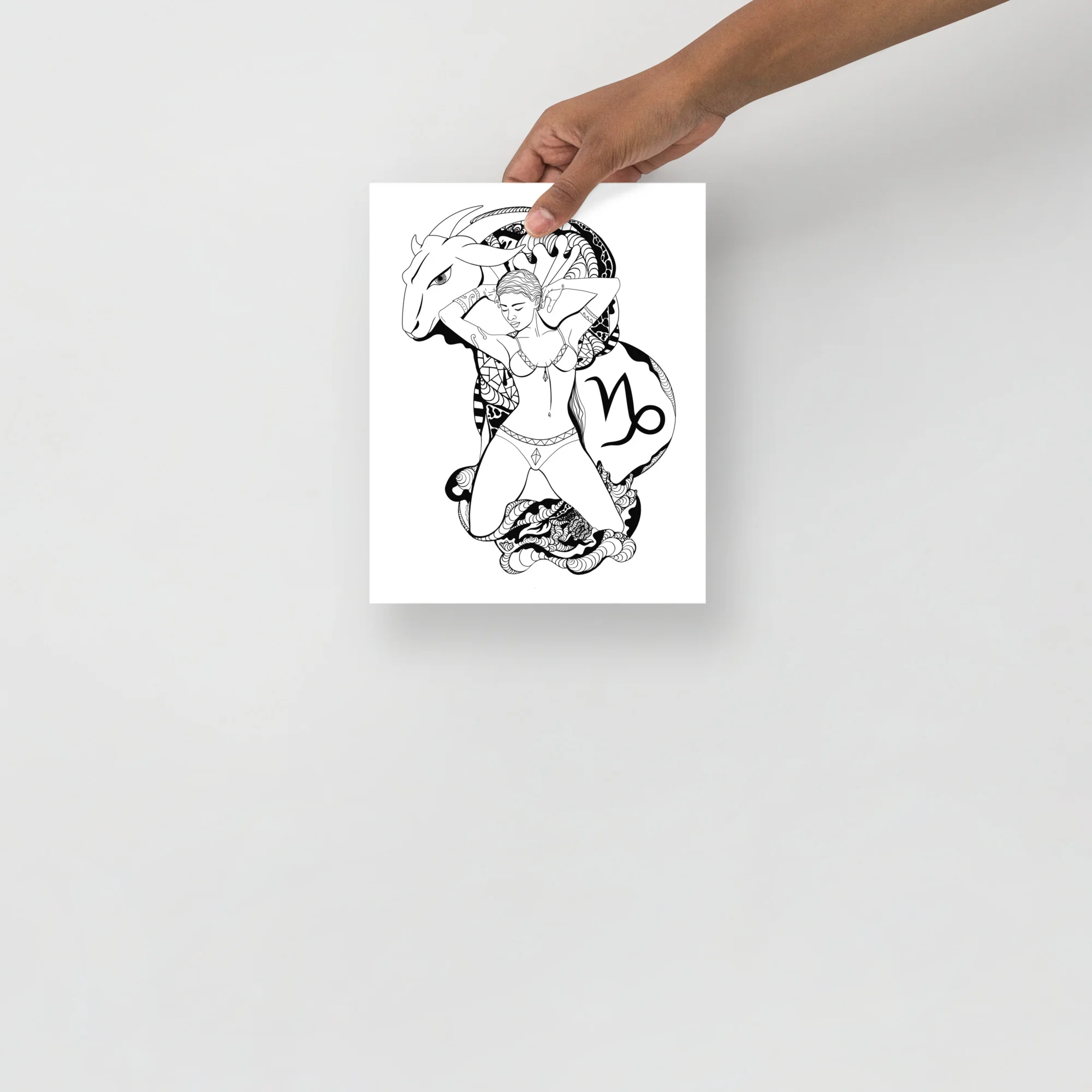 Capricorn zodiac art print featuring a woman with goat horns and celestial symbols in black line art on white matte paper