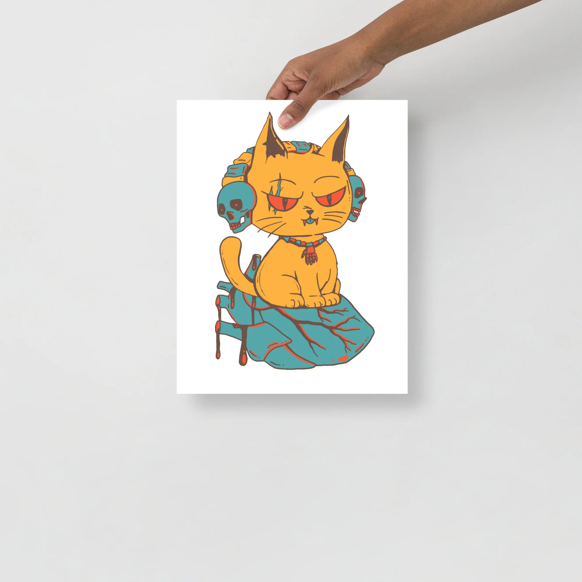 Wicked orange cat art print with mechanical details perched on a teal heart-shaped base with red accents