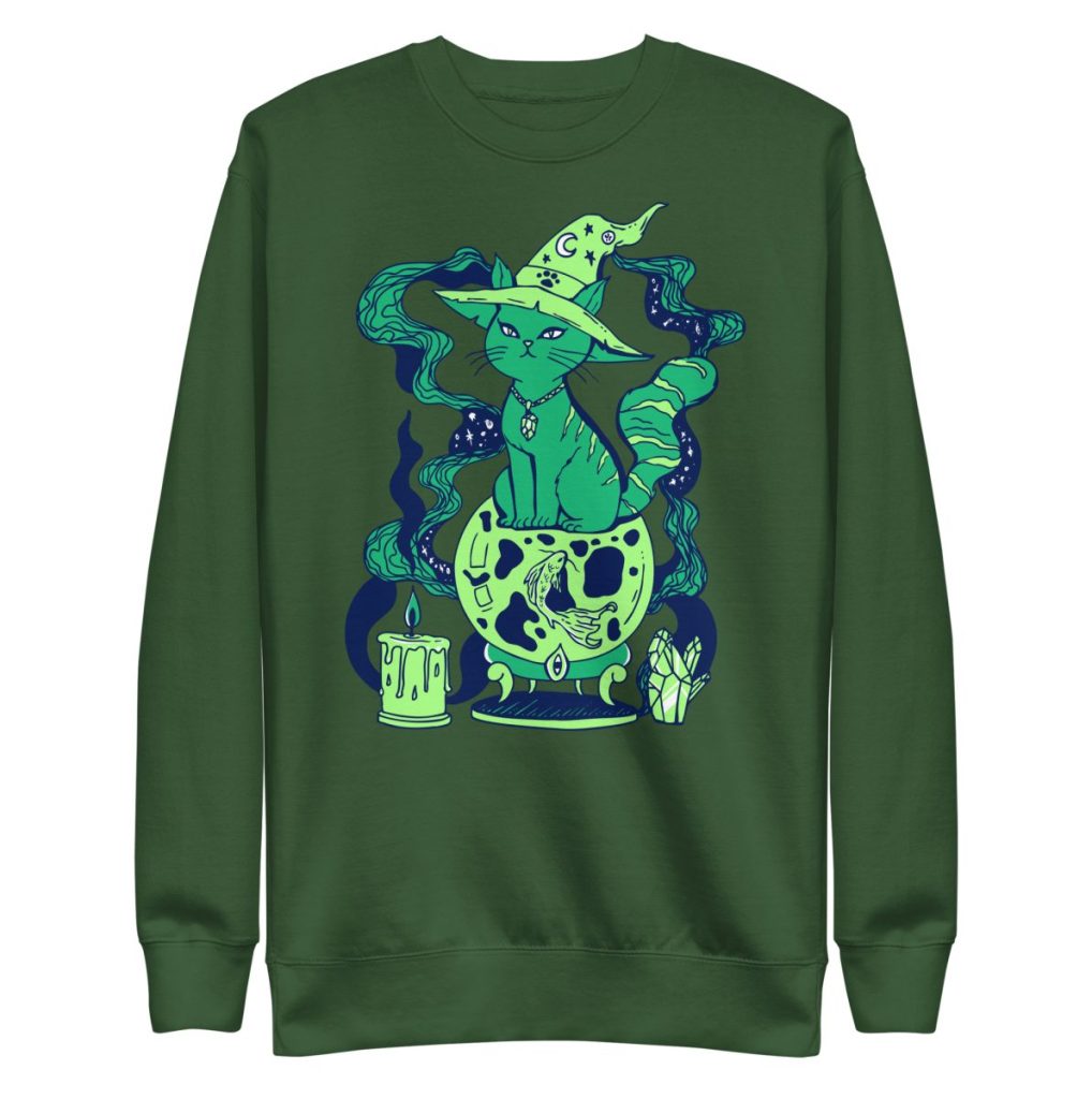 Rich forest green sweatshirt featuring whimsical magical fortune cat artwork in detail
