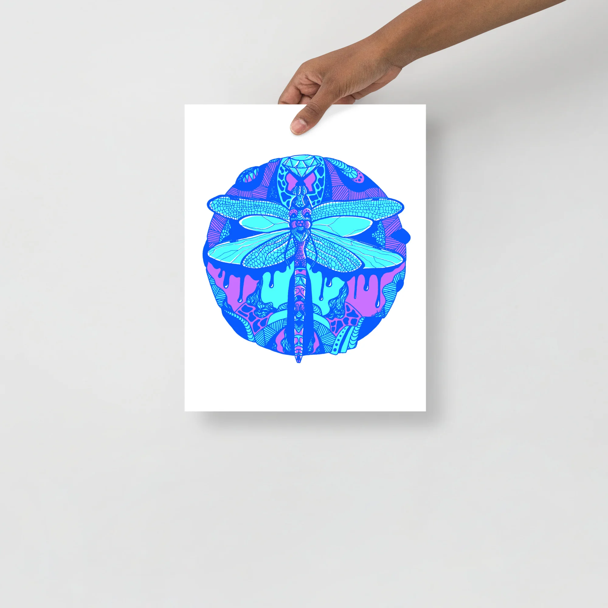 Vibrant dragonfly art print featuring cyan and magenta insect design centered in blue circle on white background
