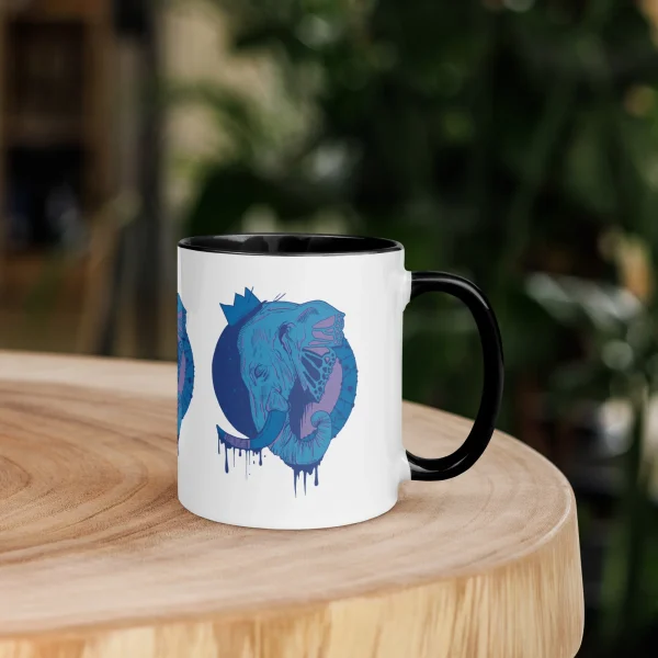 Royal elephant mug with crowned blue elephant illustration on white ceramic body and black handle