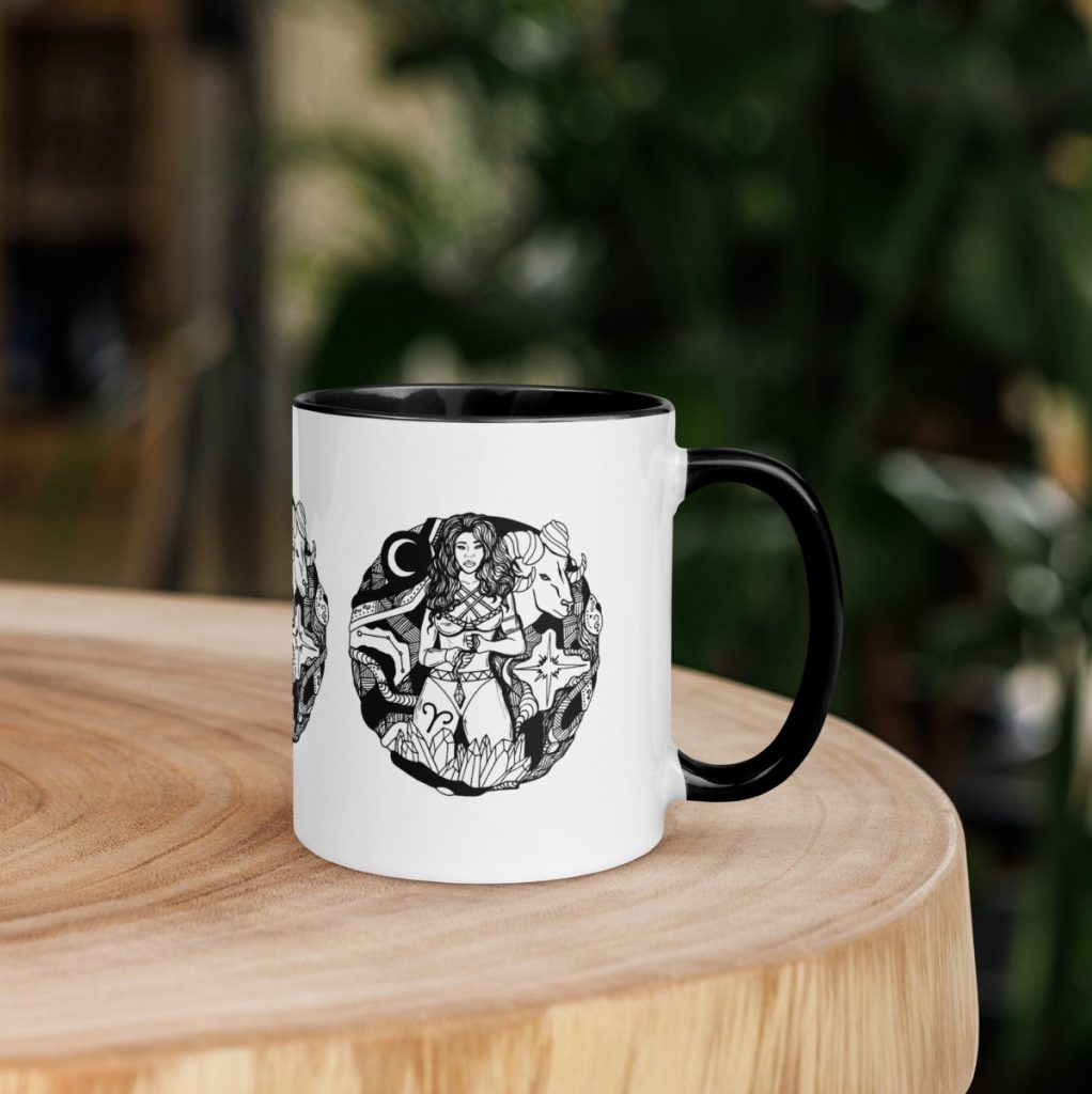 White ceramic mug featuring fire sign zodiac art with delicate Aries line drawing