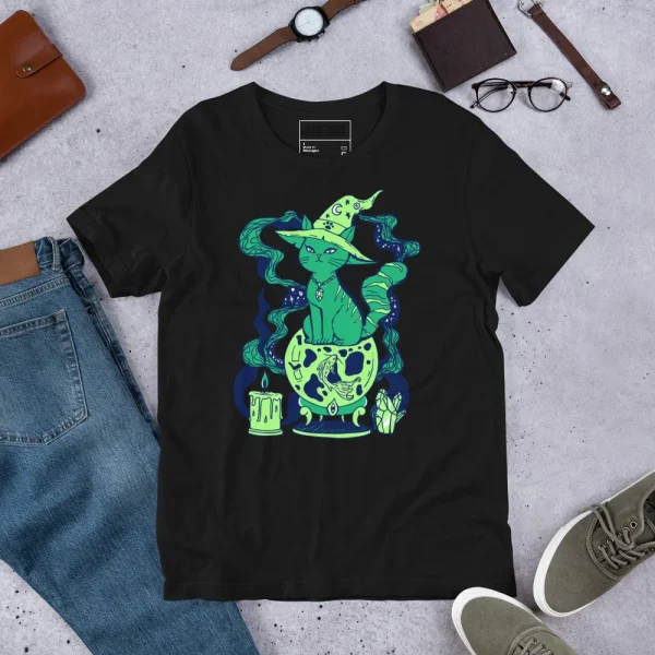 Black green cat t-shirt with magical witch hat graphic, neon green glowing design, flat lay styled with accessories