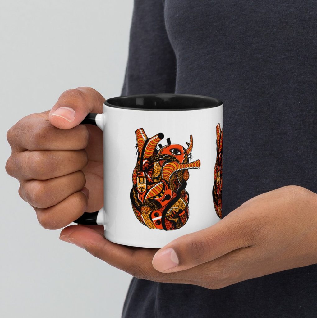 Anatomical heart illustrated on a gothic black and orange halloween coffee mug