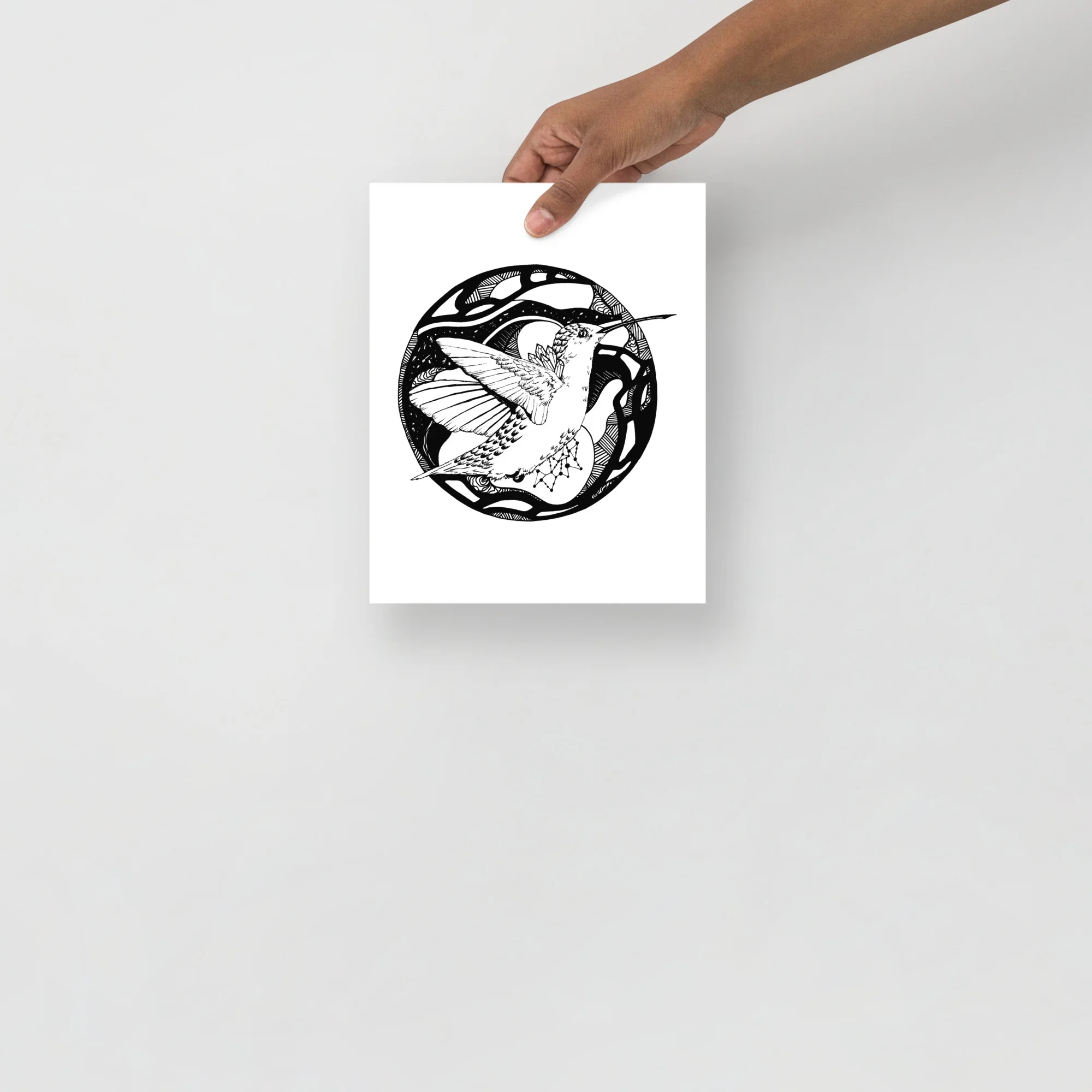 Black and white hummingbird wall art print featuring a detailed line drawing of a hummingbird in a circular frame design.