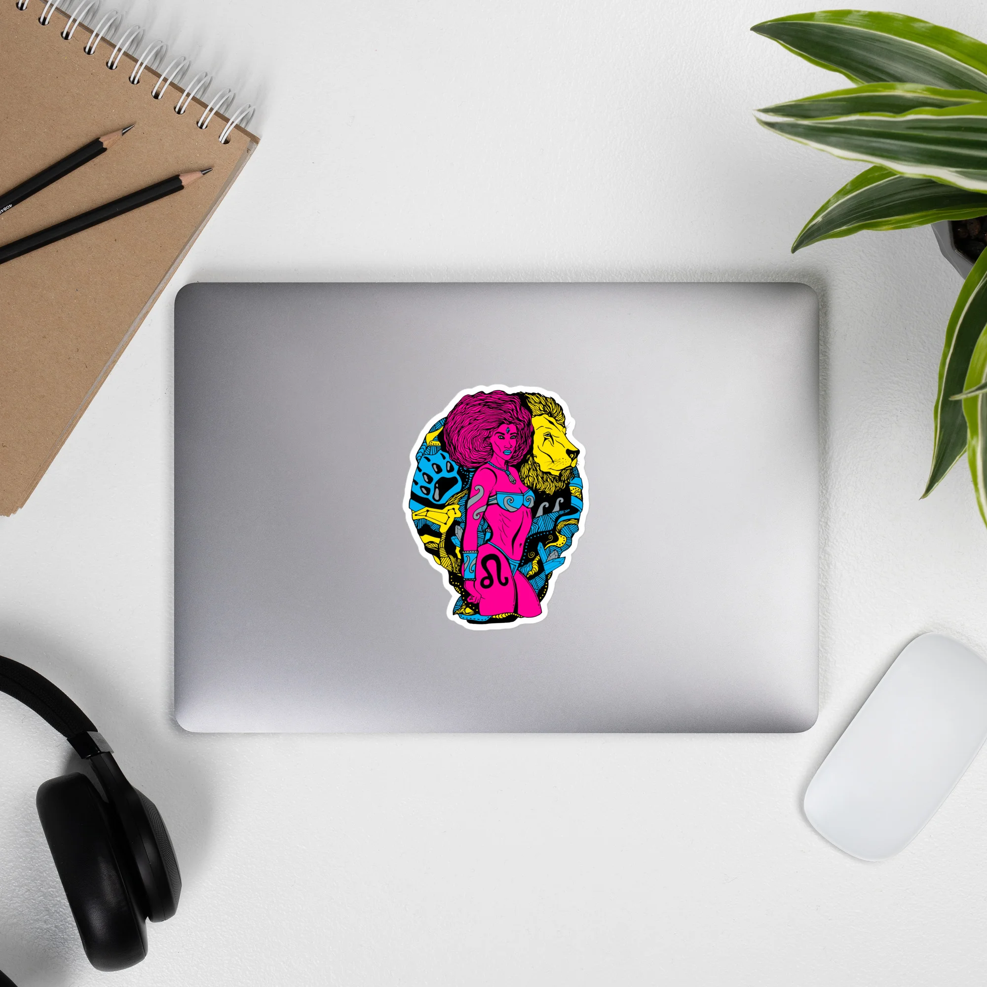 Colorful leo sticker featuring CMYK zodiac warrior art on silver laptop
