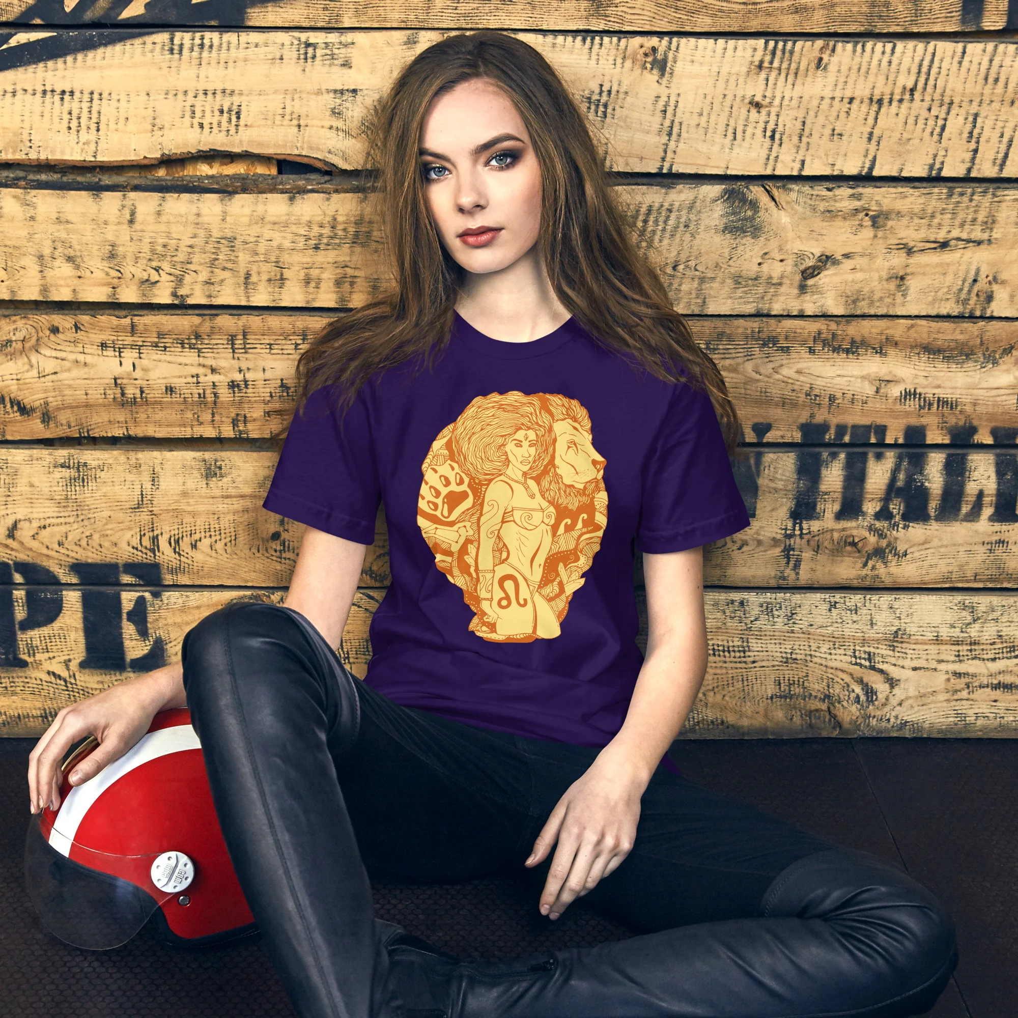Woman wearing a purple leo t-shirt with terracotta zodiac artwork featuring dual warrior profiles