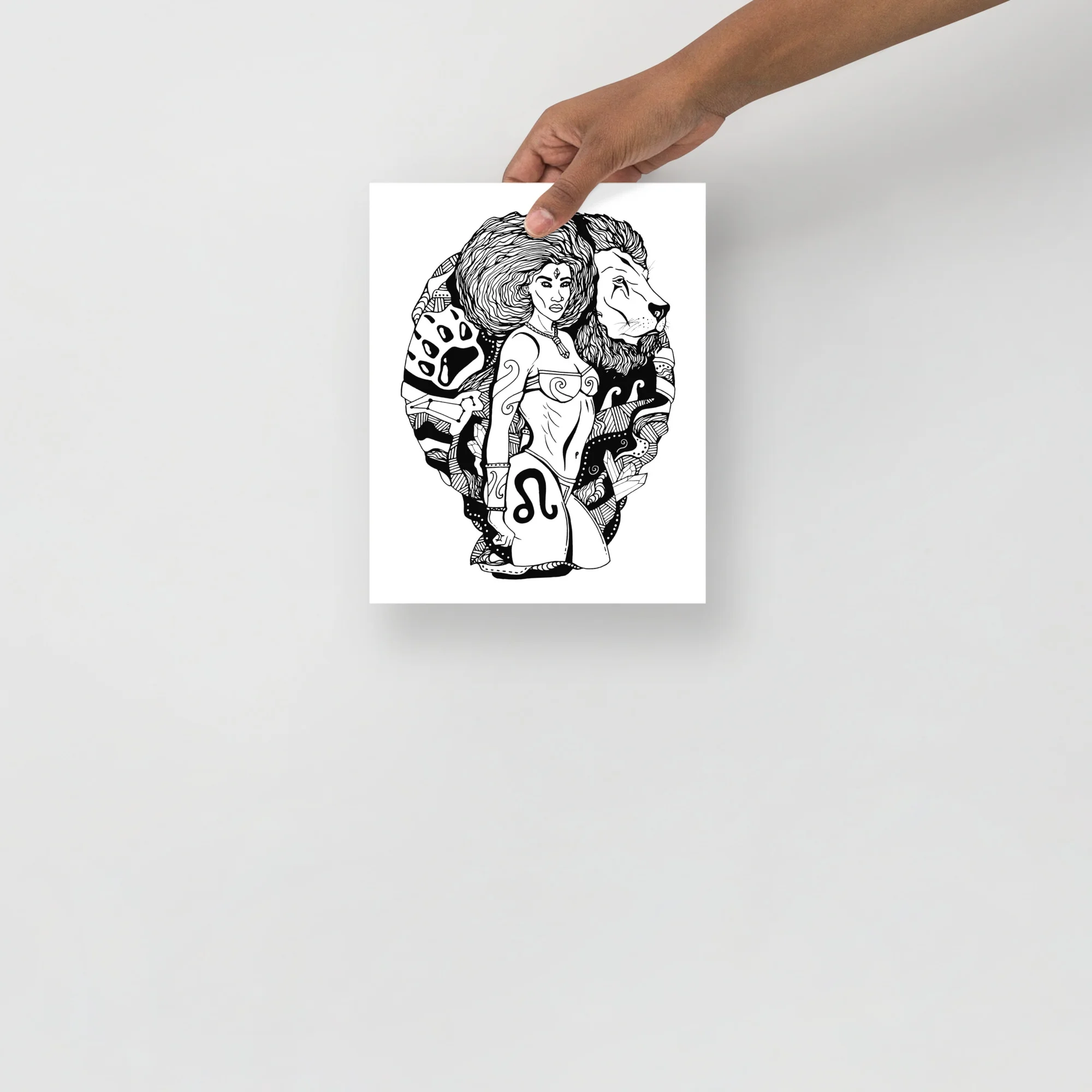Leo zodiac art print featuring a woman with flowing hair flanked by lions and celestial symbols in black line art.