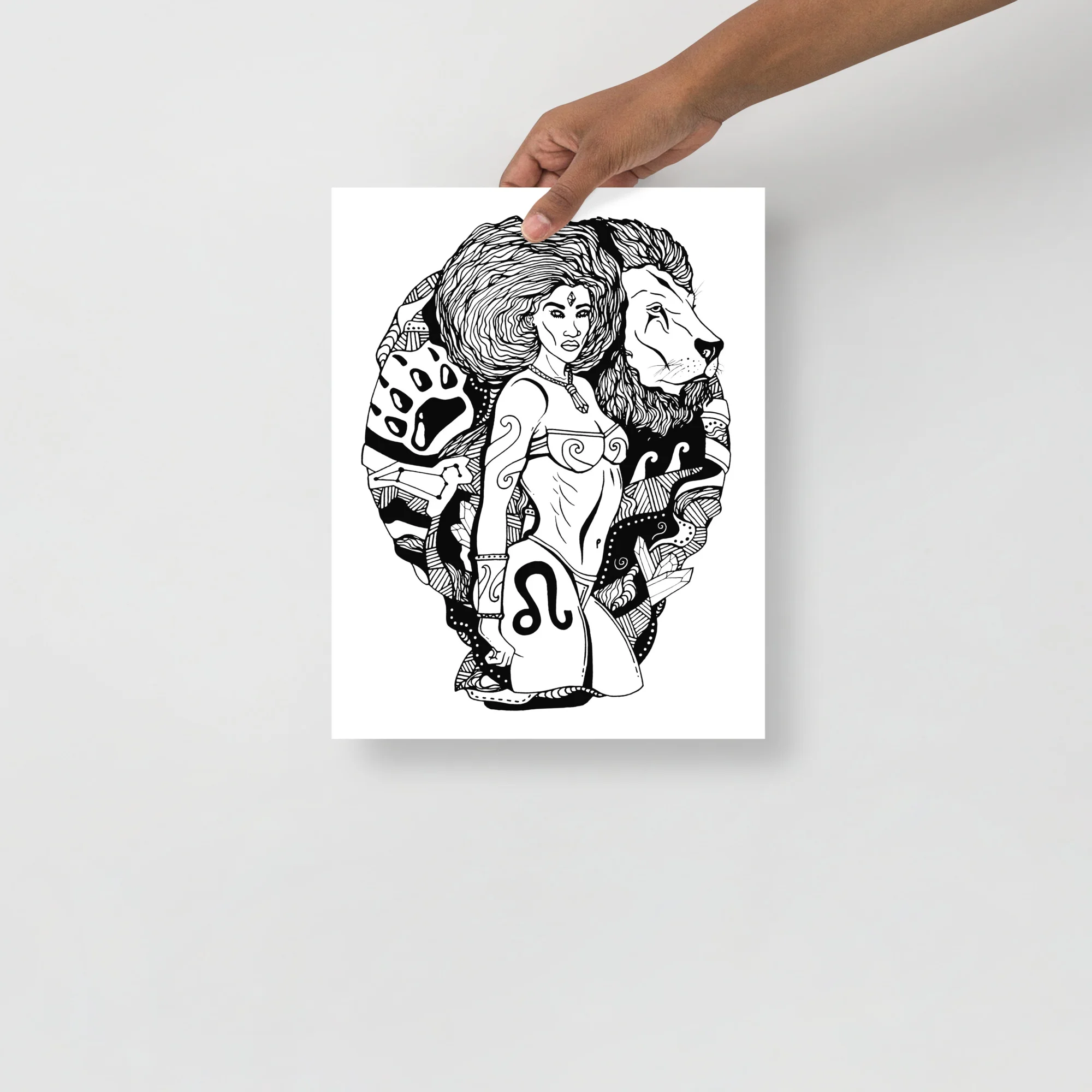 Leo zodiac art print featuring a woman with voluminous hair, lion, and celestial symbols in black ink line art on white matte paper.
