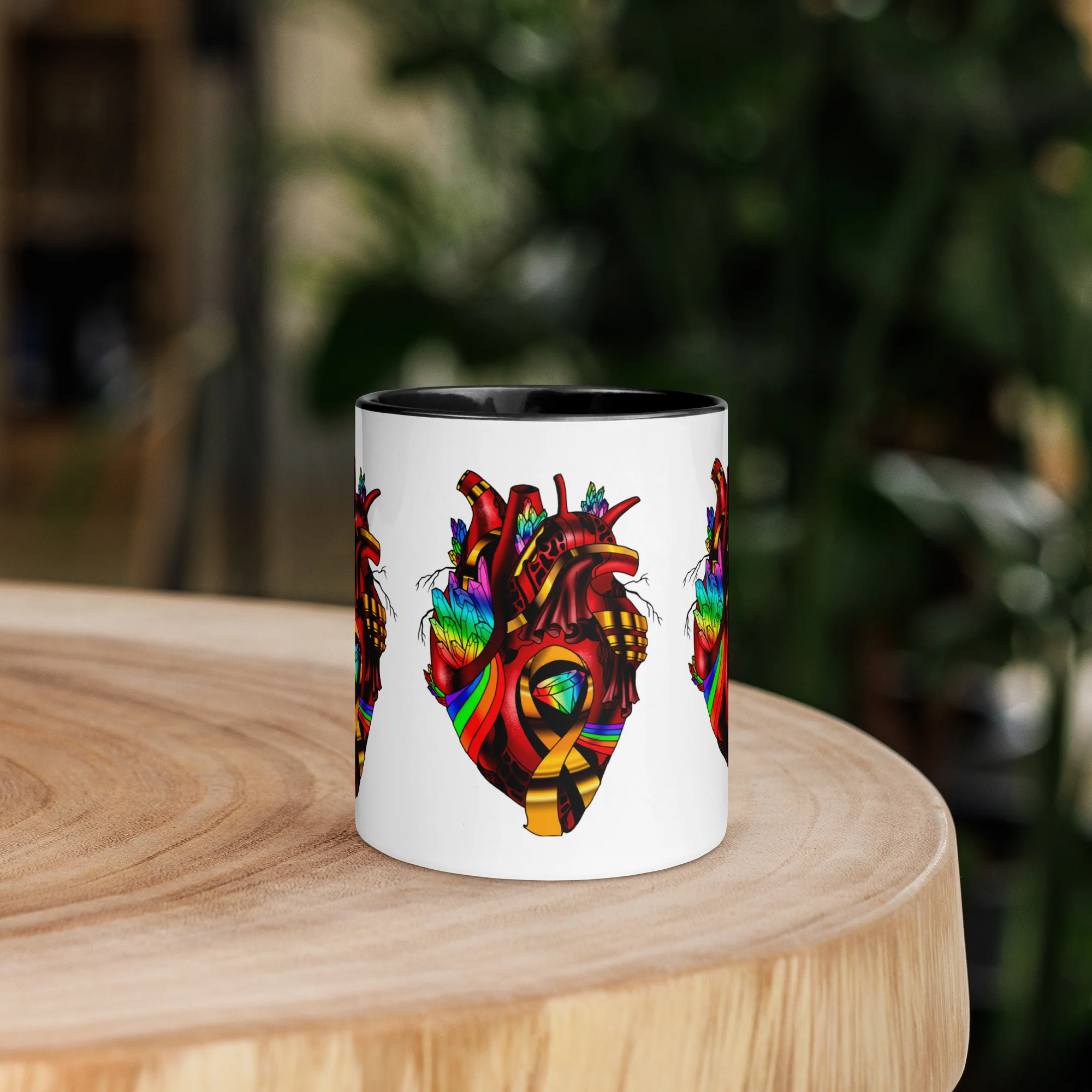 LGBTQ coffee mug with vibrant rainbow-colored anatomical heart design on white ceramic with black interior rim