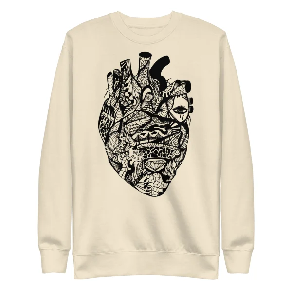 Cream-colored line art heart sweatshirt featuring an intricate black anatomical heart design with ornamental patterns
