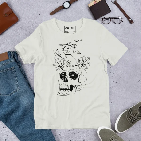 Cream cotton t-shirt featuring a magical cat and skull design with witch hat and mystical elements