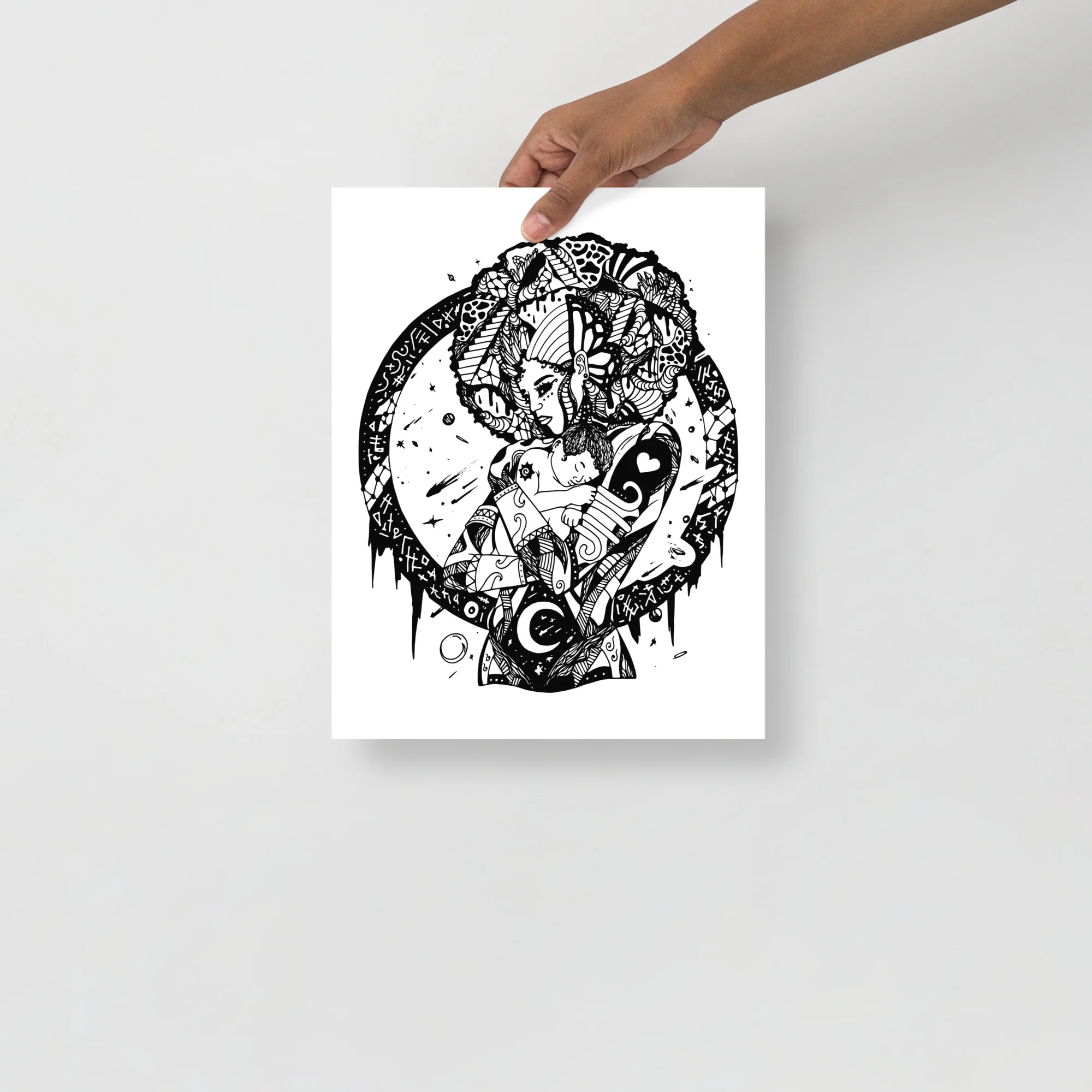 Black and white mother and child art print featuring intricate pen line work and divine feminine symbolism on white paper