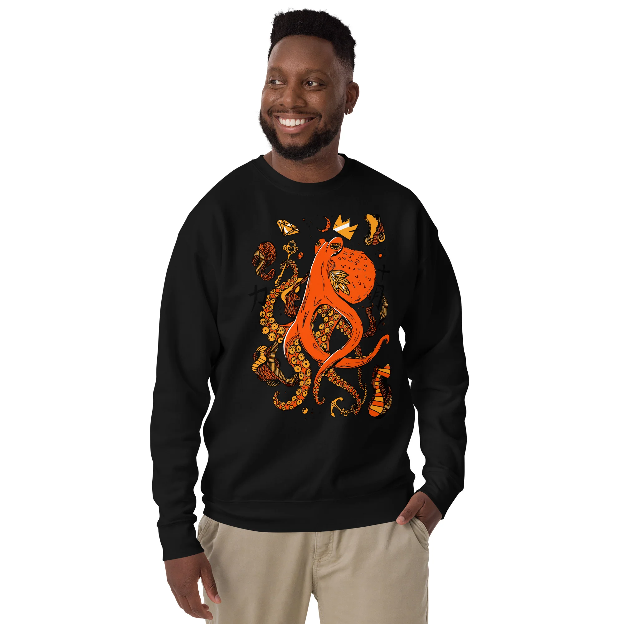 Man wearing black octopus sweatshirt with orange and gold detailed design featuring tentacles and abstract patterns