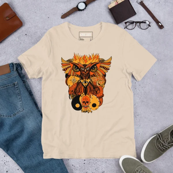 Cream-colored owl and skull t-shirt featuring bold orange and black artwork with intricate details and flames