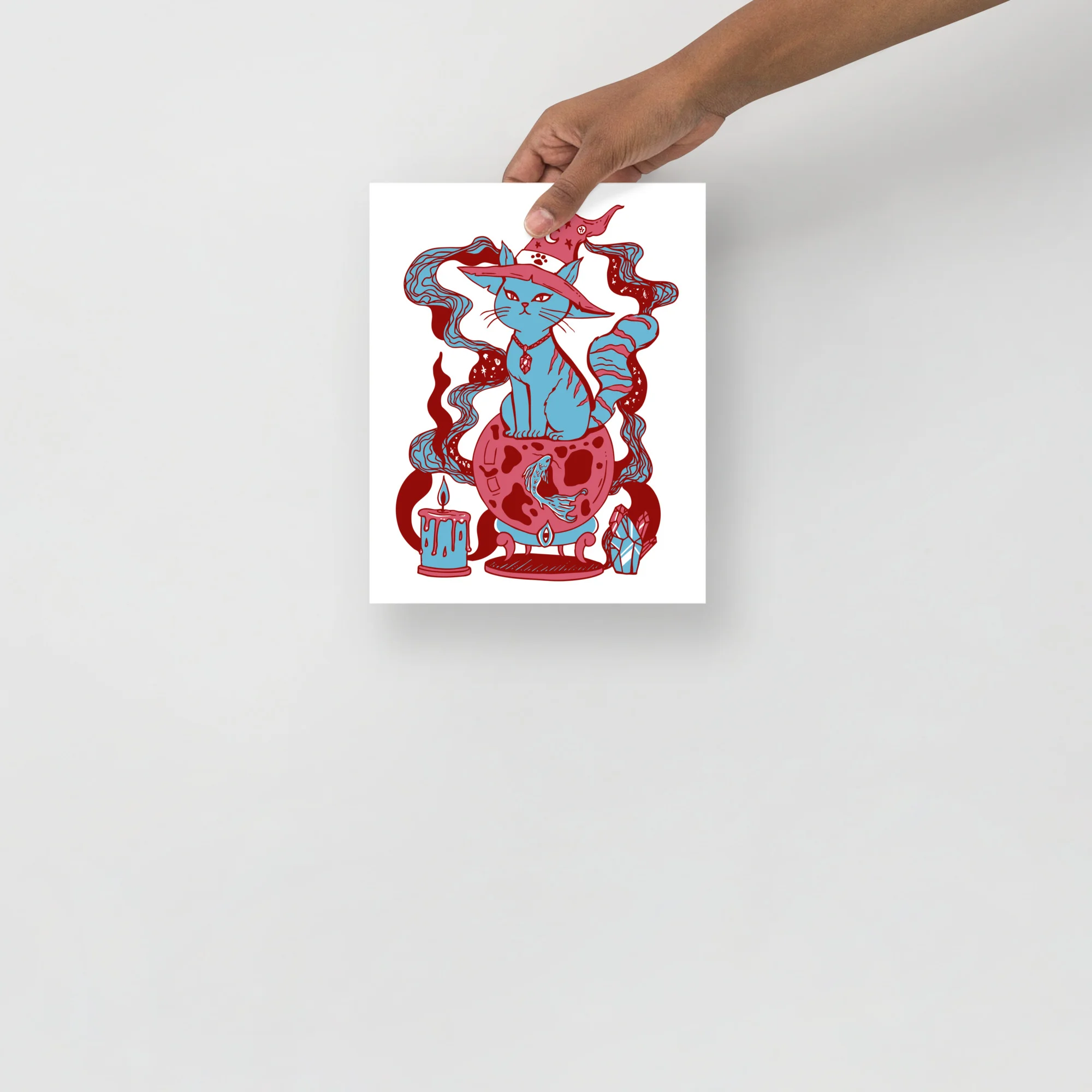 Pastel blue cat art print featuring a magical feline with flowing red and blue linework, surrounded by mystical elements and decorative swirls.