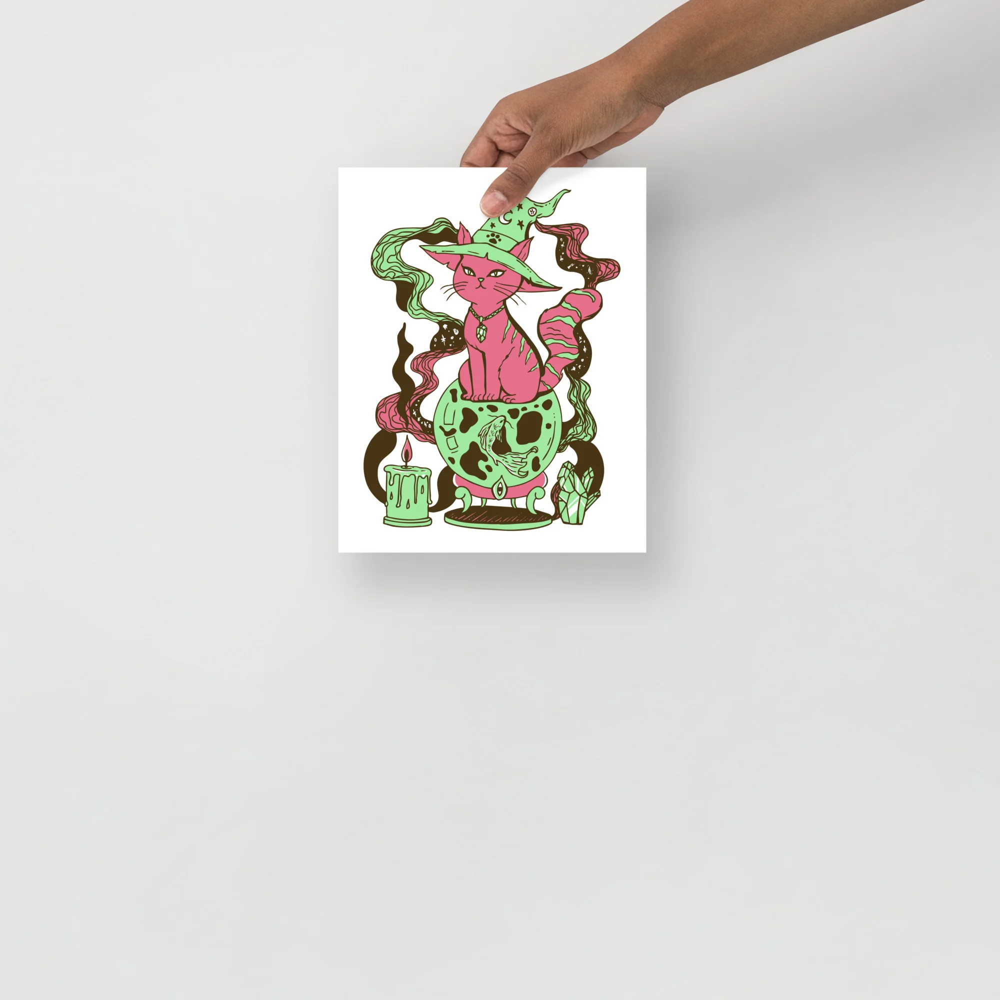 Pink cat art print with mint green accents, wearing a witch hat and surrounded by magical elements and fortune symbols.