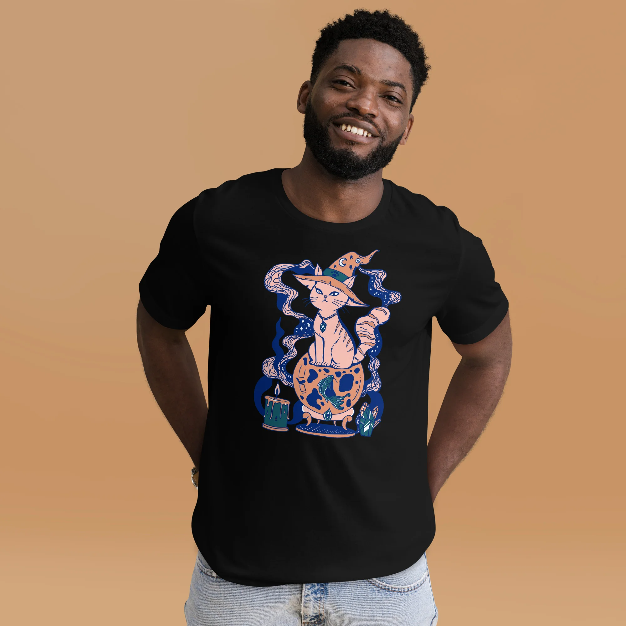 Man wearing black pink cat t-shirt with magical fortune design and enchanted graphics on tan background
